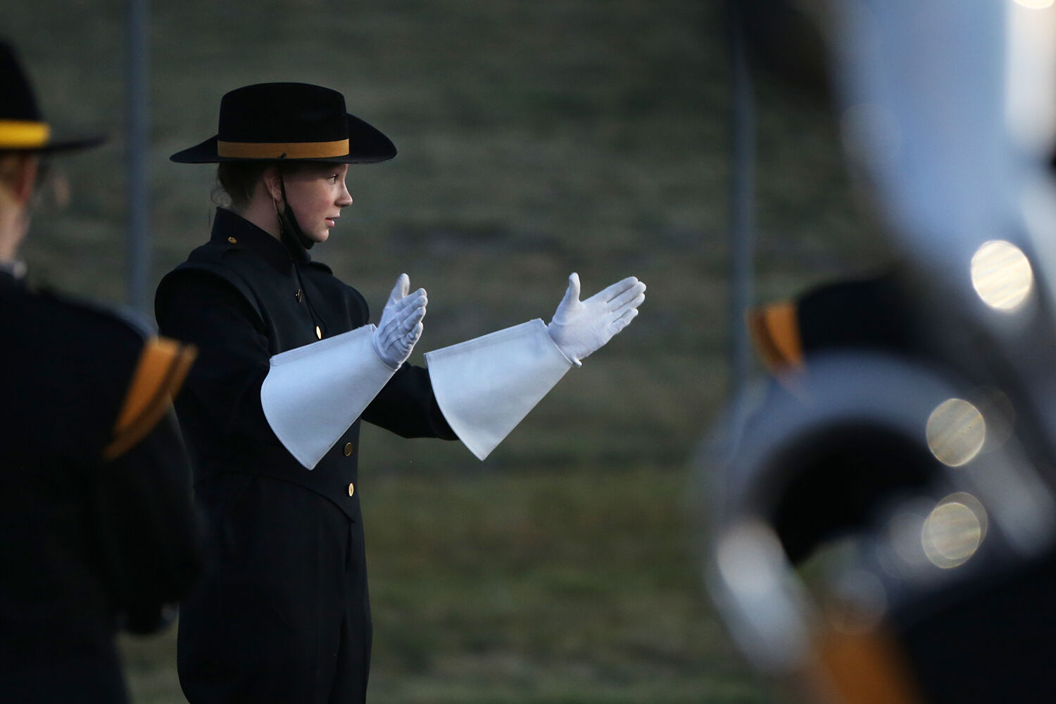drum major Makenna Lambert works with fellow drum major Gabe Cahhal-Laudert to lead the band